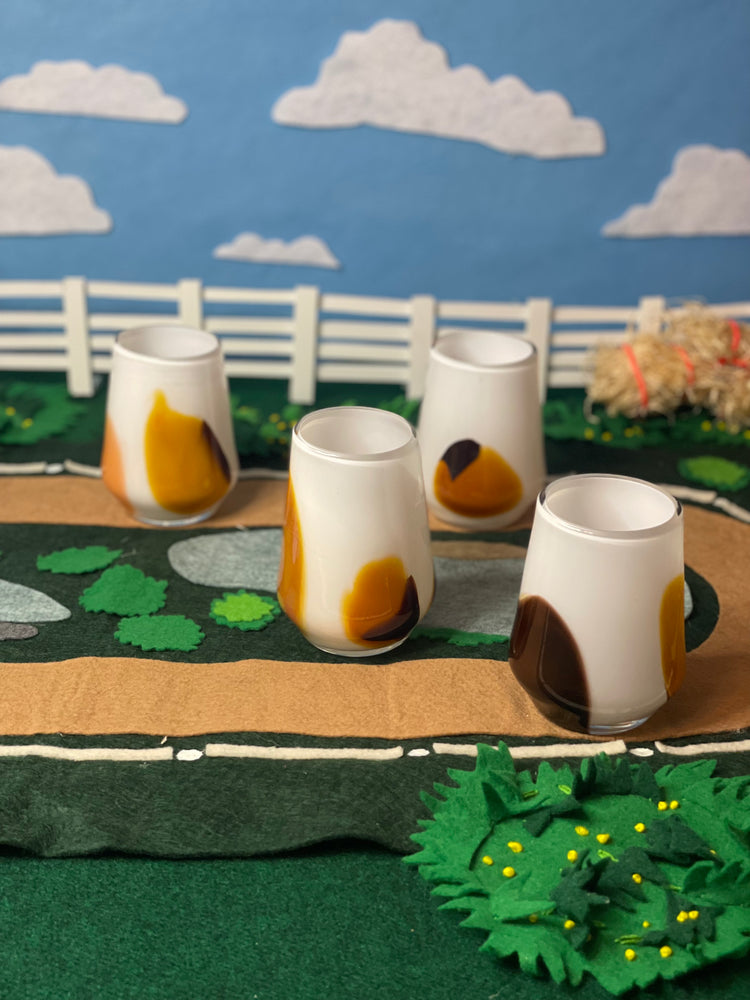 Brown American Paint Thoroughbred Tumbler on racetrack