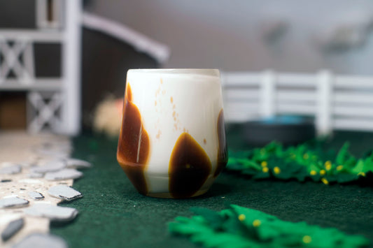 Brown American Paint Thoroughbred Tumbler in a field